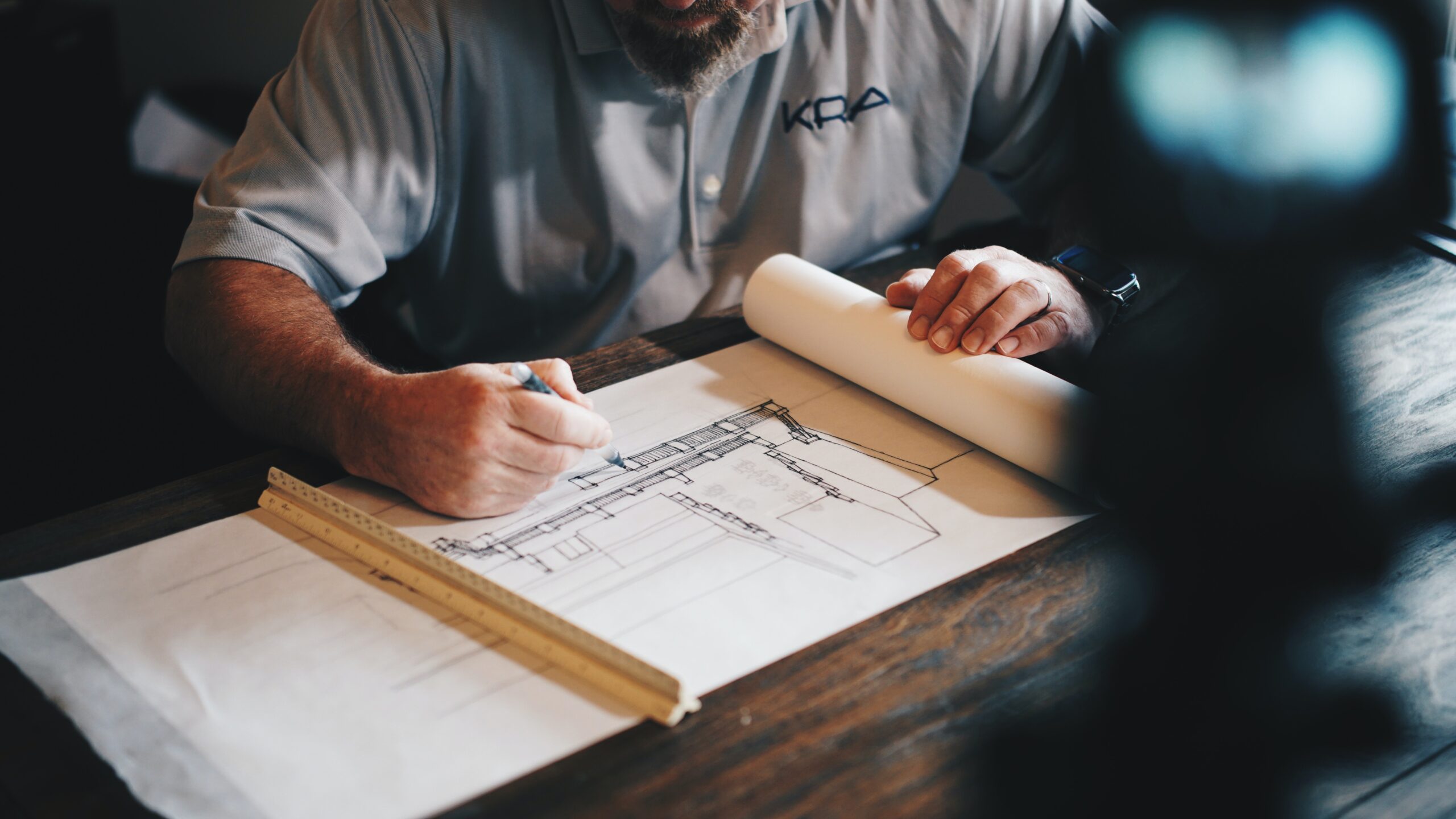 Facility manager working on paper plans